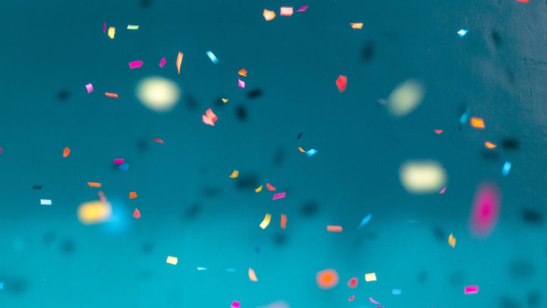 Confetti against a light blue background