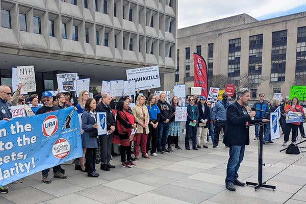 Todd Wolfson, president of the AAUP, speaks at a rally.