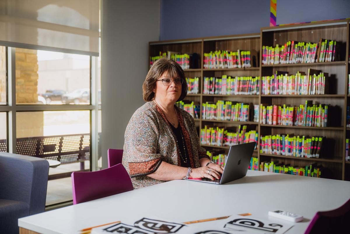 THROCKMORTON, TEXAS — JULY 29, 2025: Gay Hibbitts, 57, educator, poses for a portrait at Throckmorton Collegiate ISD in Throckmorton, Texas, on Tuesday, July 29, 2025. Ms. Hibbitts was part of a federally funded educator preparation program serving about 30 participants across 11 rural Texas districts. The funding, which covered two years of college and training costs, was cut on April 25 under the Trump and Elon Musk DOGE initiative, leaving her uncertain about her future. She is pursuing a bachelor’s degree in general studies with an emphasis in education and a minor in psychology at West Texas A&M. CREDIT: Desiree Rios for The Texas Tribune