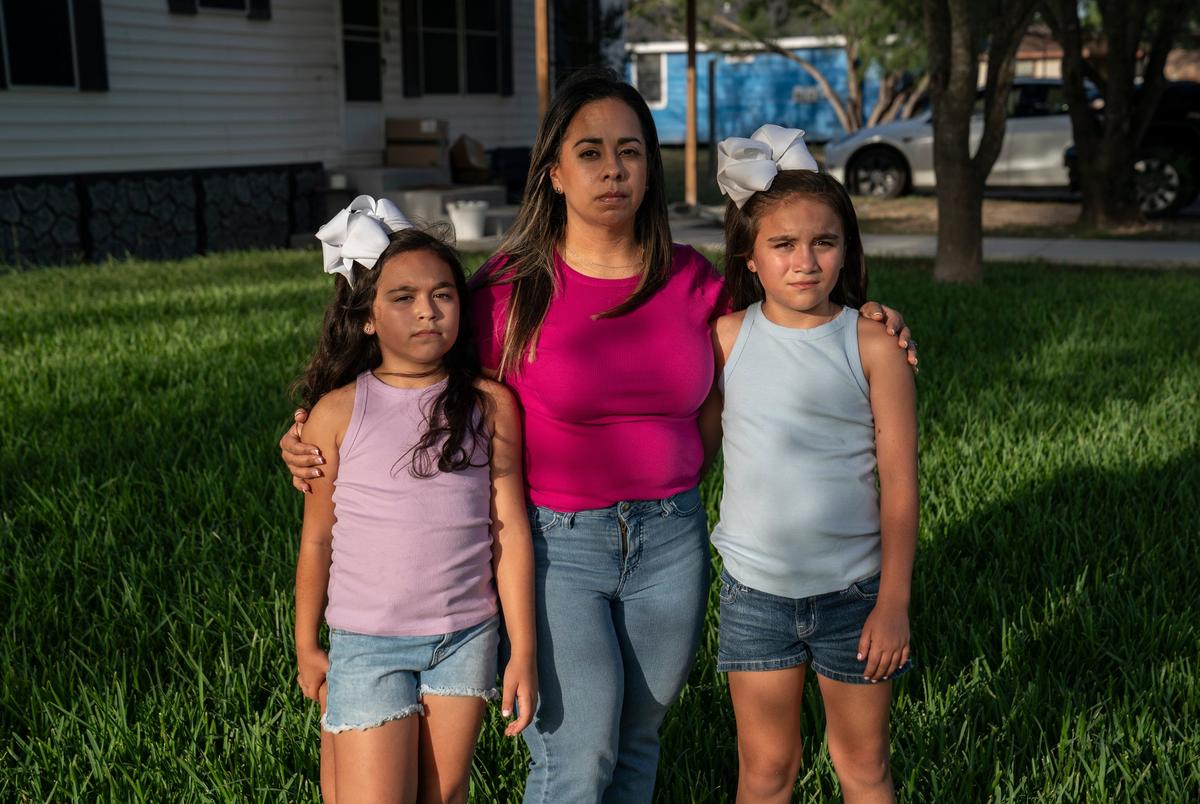 Clarissa Méndez, 44, and her daughters Catiana Ester Méndez, 7, left, and Catalaya Avaneh Méndez, 8, pose for a photo at their home in Hebbronville, Texas on July 30, 2025. Méndez makes a daily one-hour commute to Laredo to work as a nurse. Currently she has her father or another person pick up her daughters from the daycare and take care of them for about an hour until she comes back from work. After picking up her daughters she cooks for them and spends some time with them before she starts working from home for an additional three to four hours. The family does not receive any government assistance and she does not have the support to take care of her daughters while she works. After school programs like ACE allow her to save some money in daycare costs in addition to her daughters learning entrepreneurial skills, get help with homework, etc.
Gabriel V. Cárdenas for The Texas Tribune